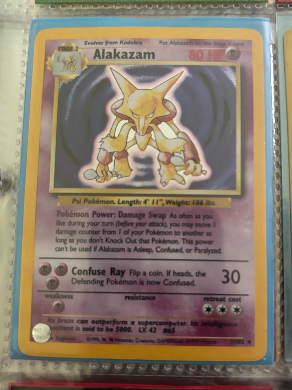 Base Set Pokemon Alakazam Holo Card - Purple, Yellow, Gold